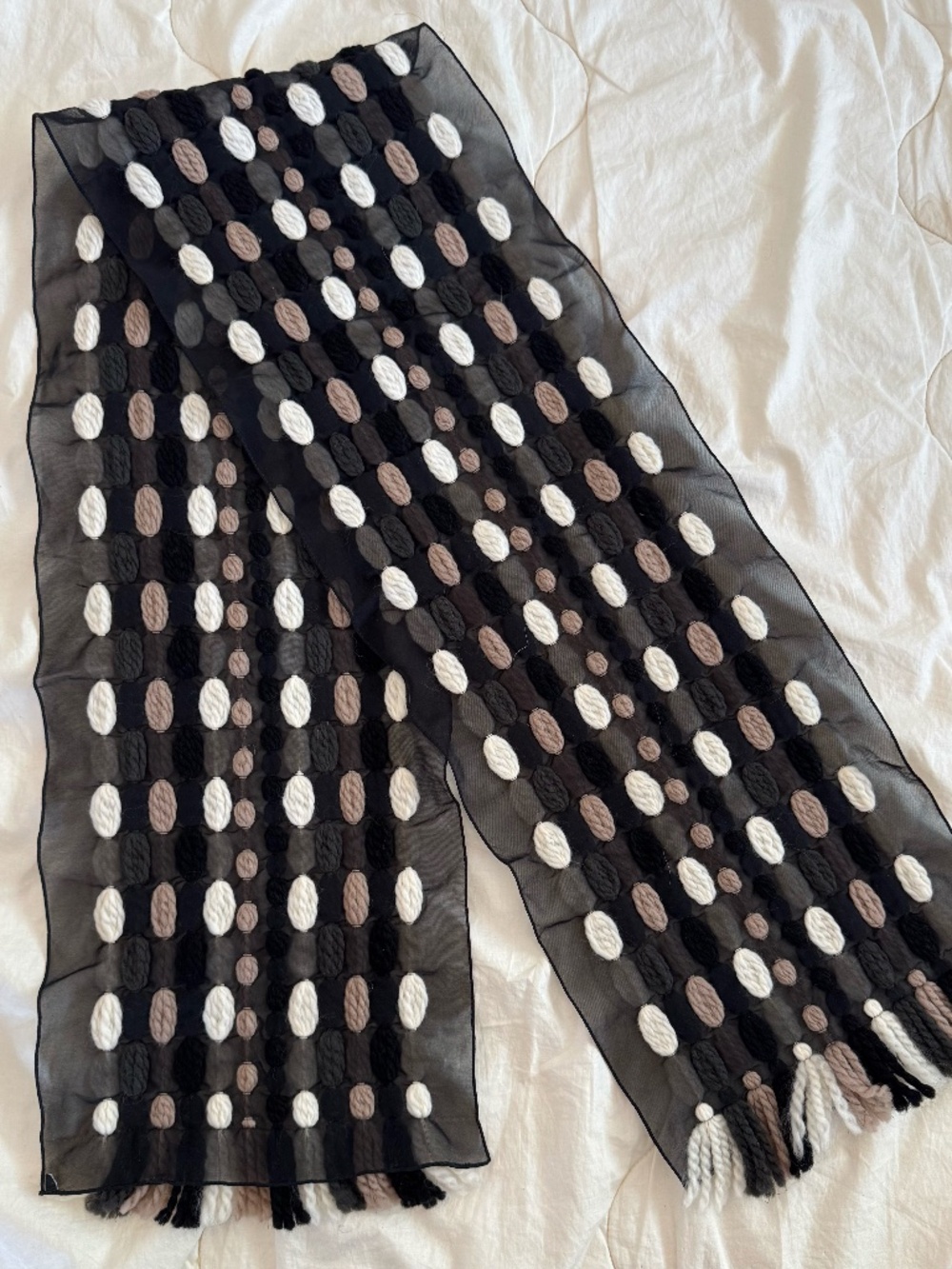 Black sheer scarf with woven knit pattern